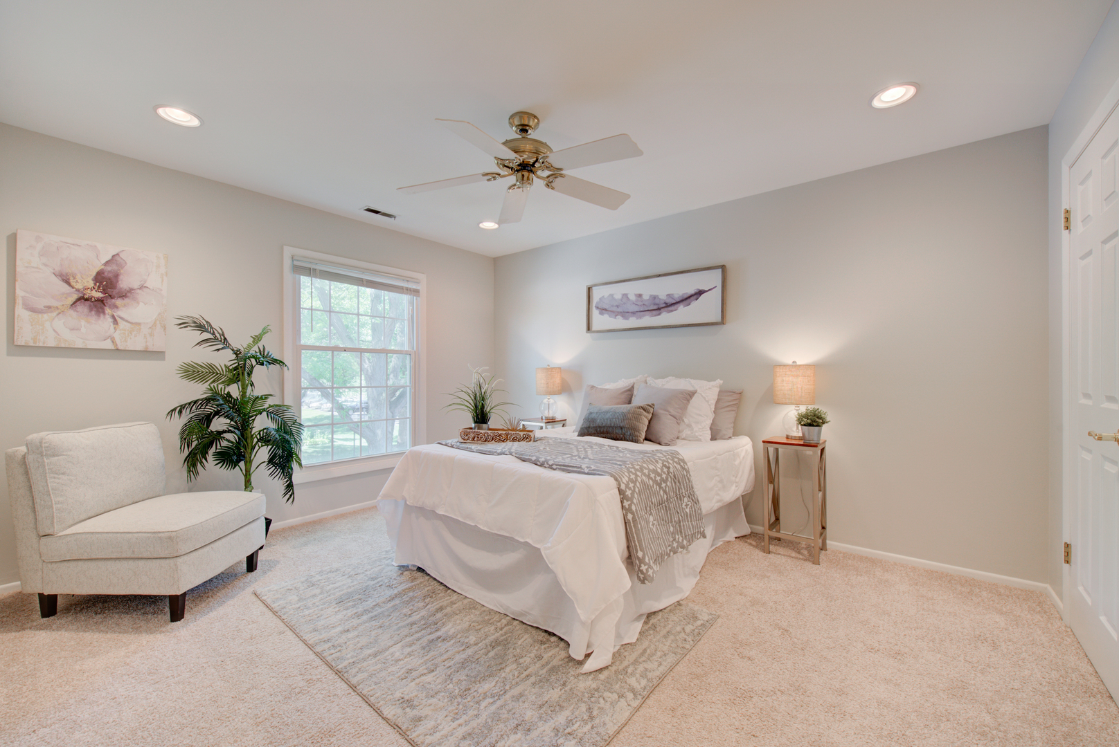 2710 Northampton Drive, Unit C2 Rolling Meadows, IL 60008 - Photo 10 of 19 a bedroom with a large bed couch and a window