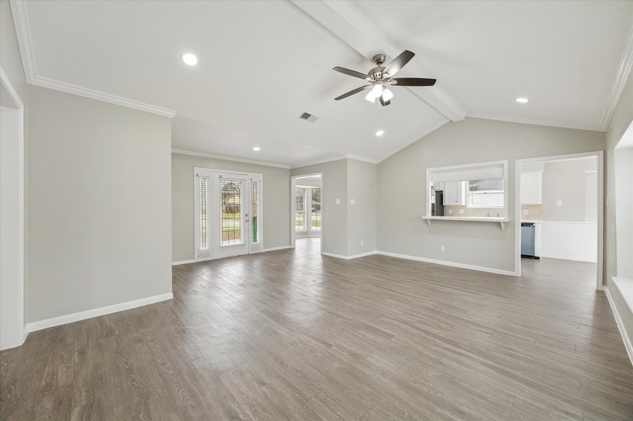 23834 English Oak Drive Spring, TX 77373 - Photo 4 of 11 a view of an empty room with wooden floor and a ceiling fan