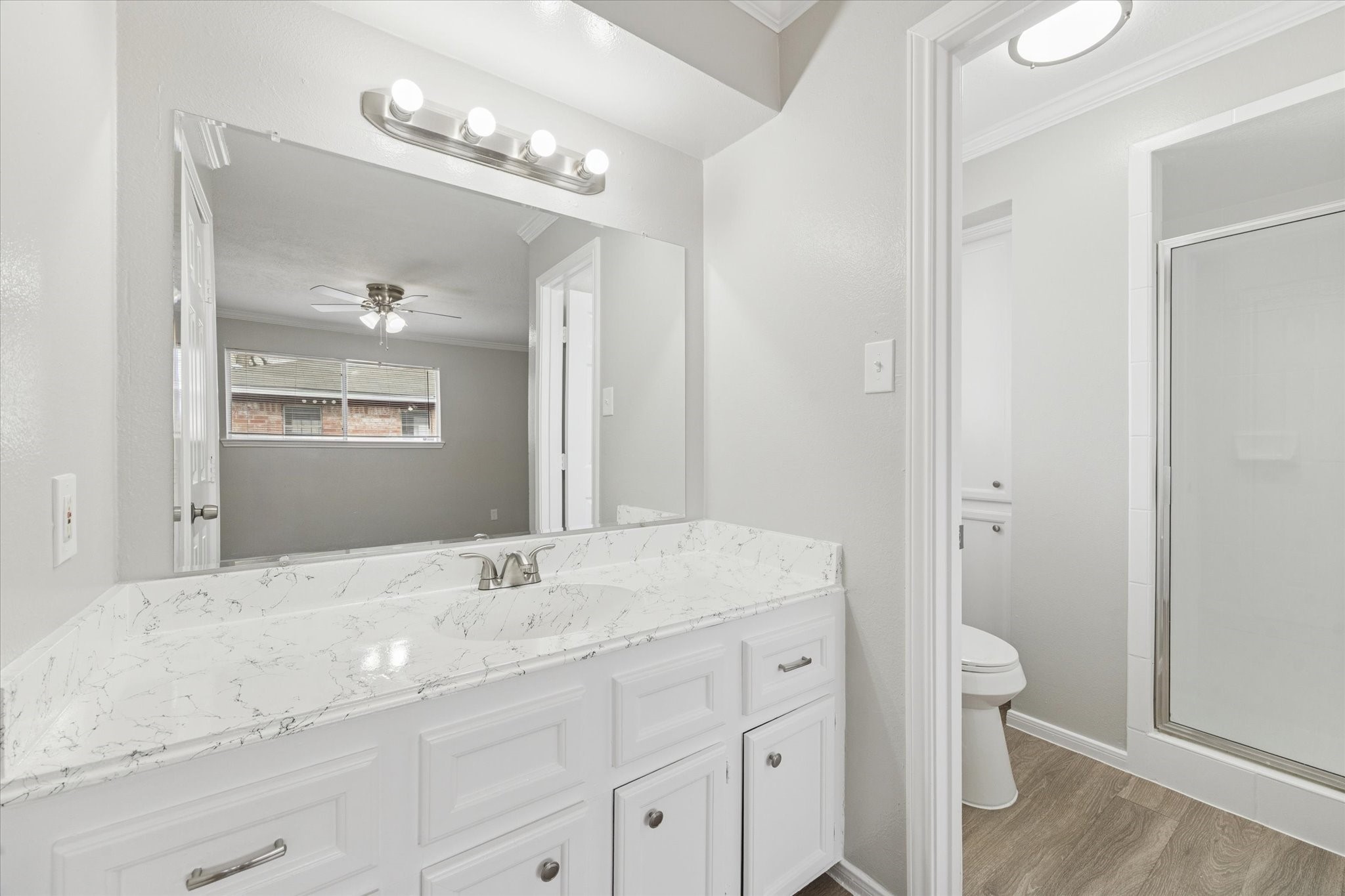 23834 English Oak Drive Spring, TX 77373 - Photo 6 of 11 a bathroom with a sink shower and a mirror