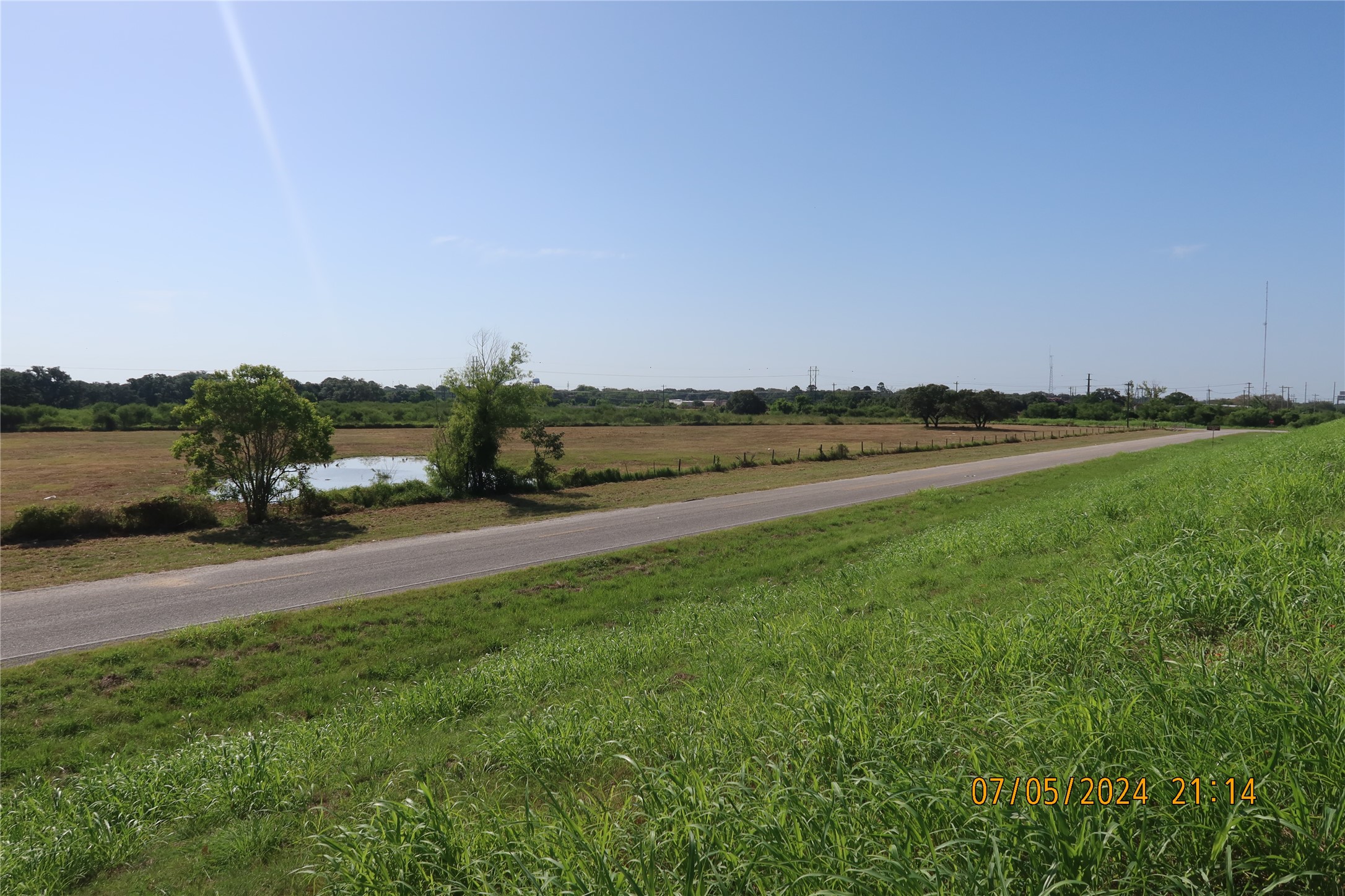 1046 Railhead Road Columbus, TX 78934 - Photo 13 of 24 a view of a lake with houses in the back