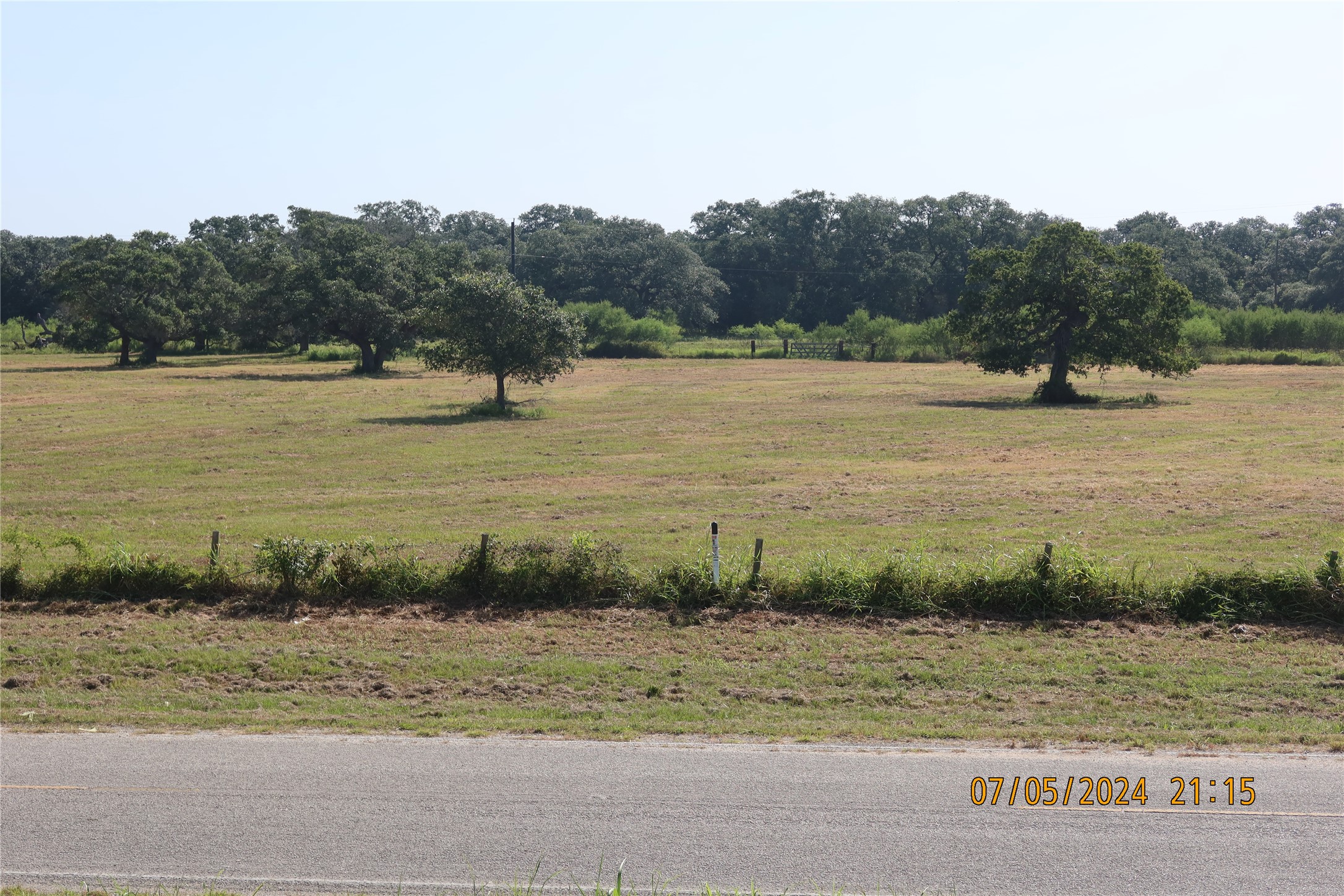 1046 Railhead Road Columbus, TX 78934 - Photo 19 of 24 a view of a lake from a yard