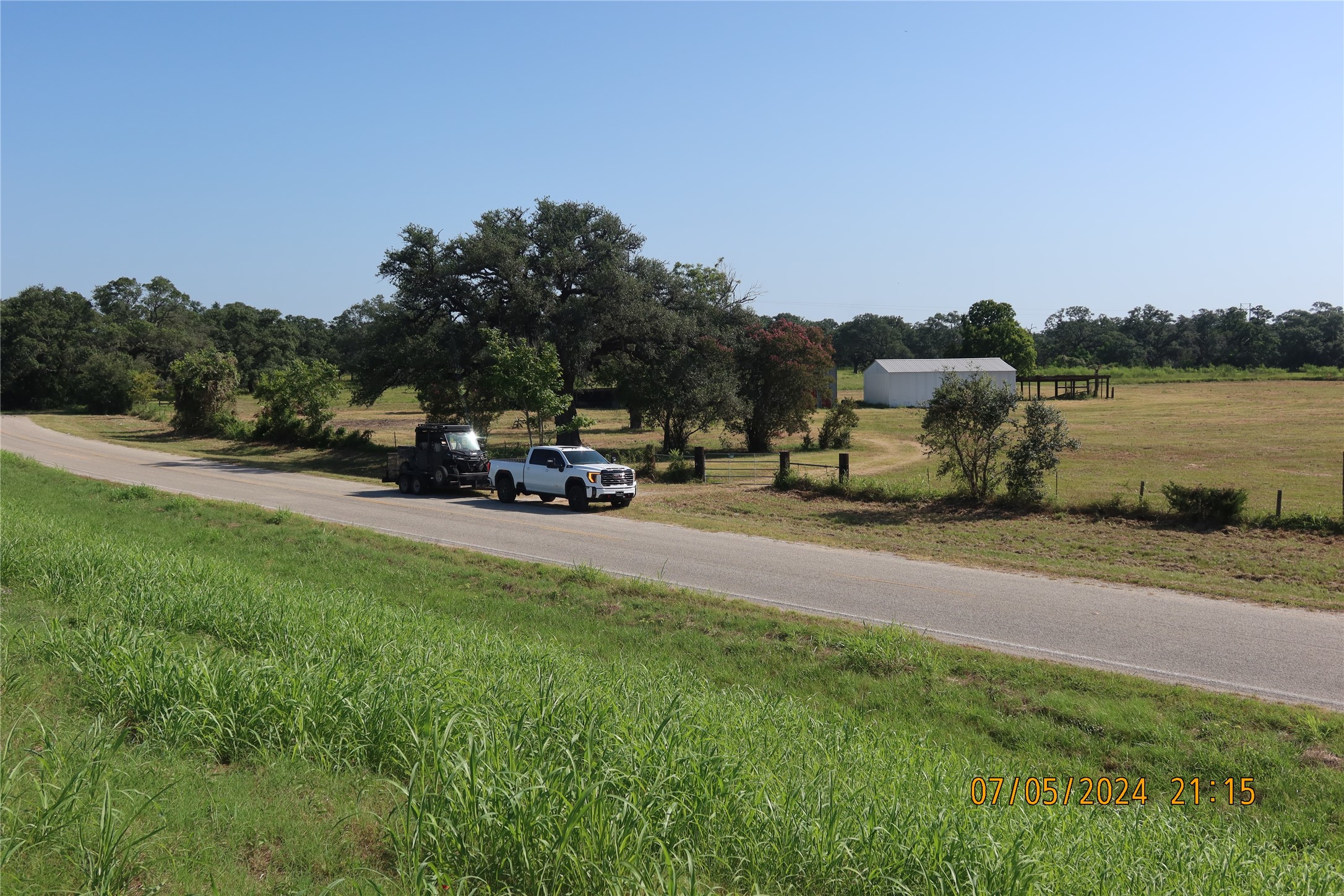 1046 Railhead Road Columbus, TX 78934 - Photo 20 of 24 a car parked on the side of the road
