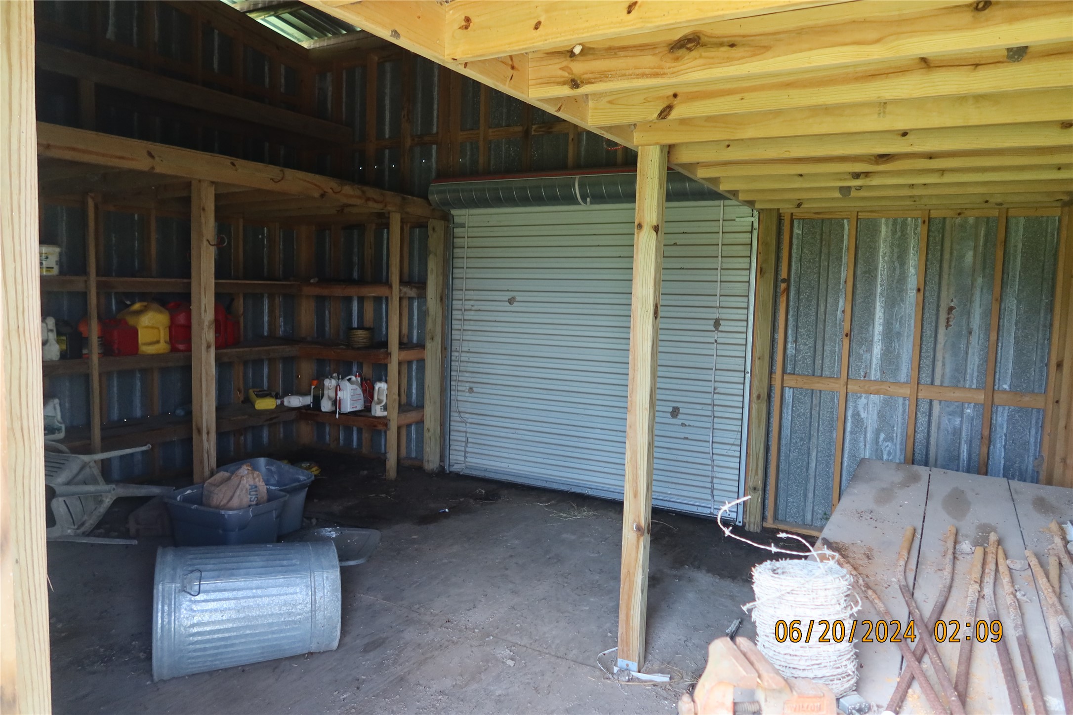 1046 Railhead Road Columbus, TX 78934 - Photo 24 of 24 a view of a patio with table and chairs and a barbeque