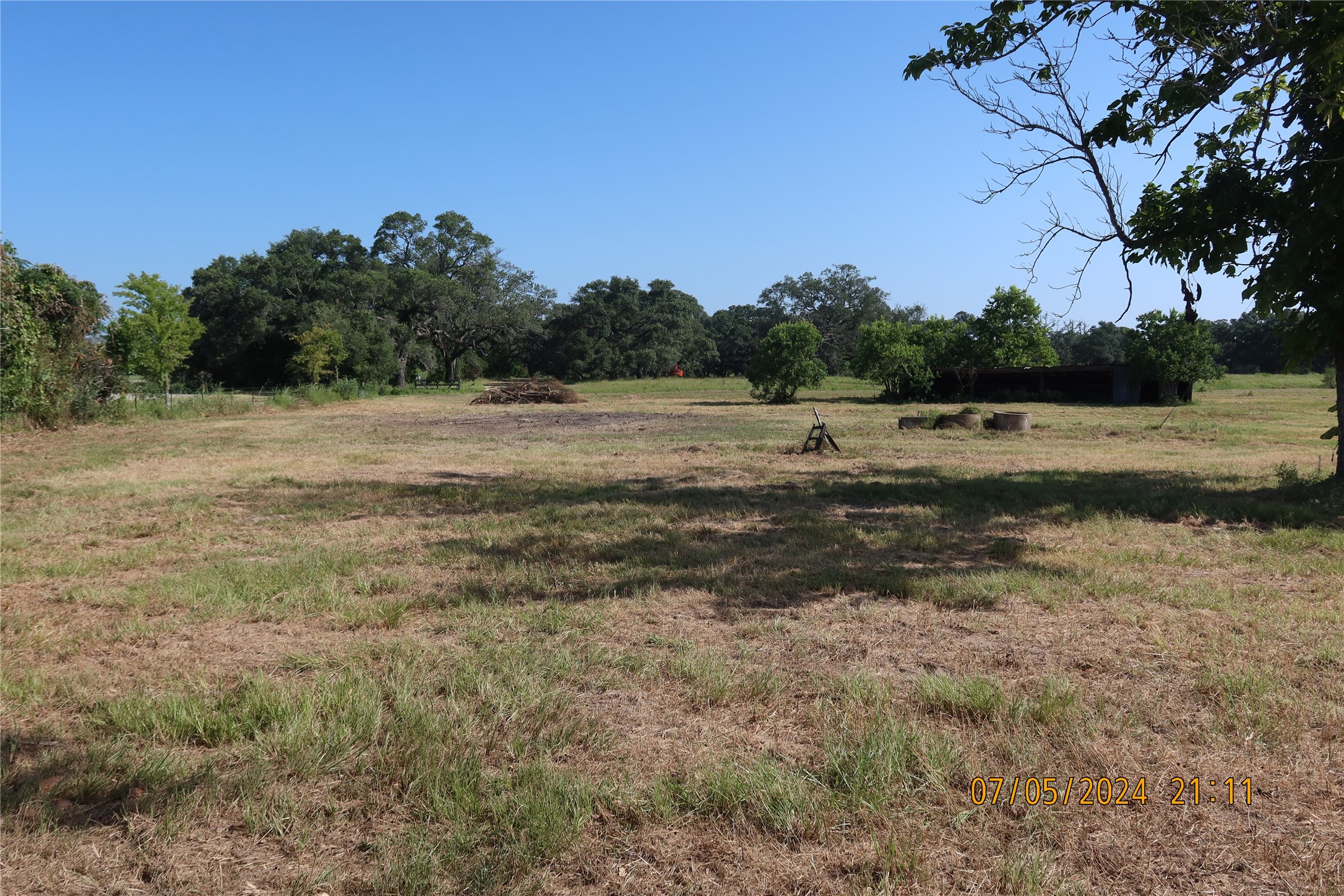 1046 Railhead Road Columbus, TX 78934 - Photo 7 of 24 a view of dirt field with trees in background
