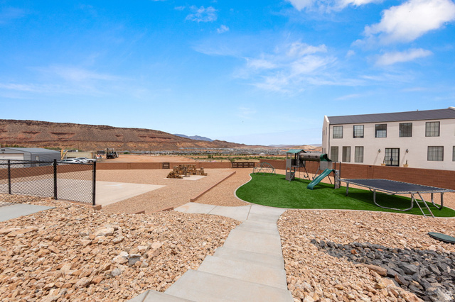 2591 East Washington Dam Road Washington, UT 84780 - Photo 50 of 67 Expansive outdoor area featuring a manicured artificial turf section and a surrounding gravel landscape