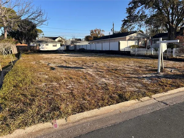 a view of a car park in front of a house