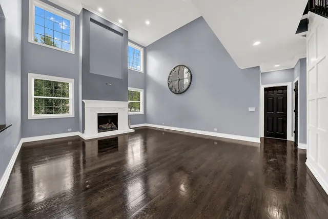 a view of a livingroom with an empty space and a fireplace