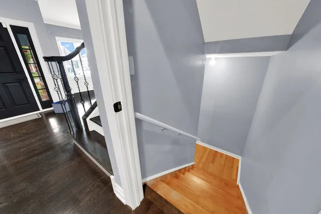 a view of an entryway with wooden floor