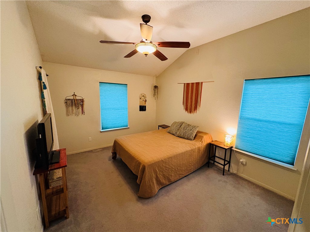369 County Road 3367 Kempner, TX 76539 - Photo 8 of 18 a bedroom with a bed and a flat tv screen on the dresser