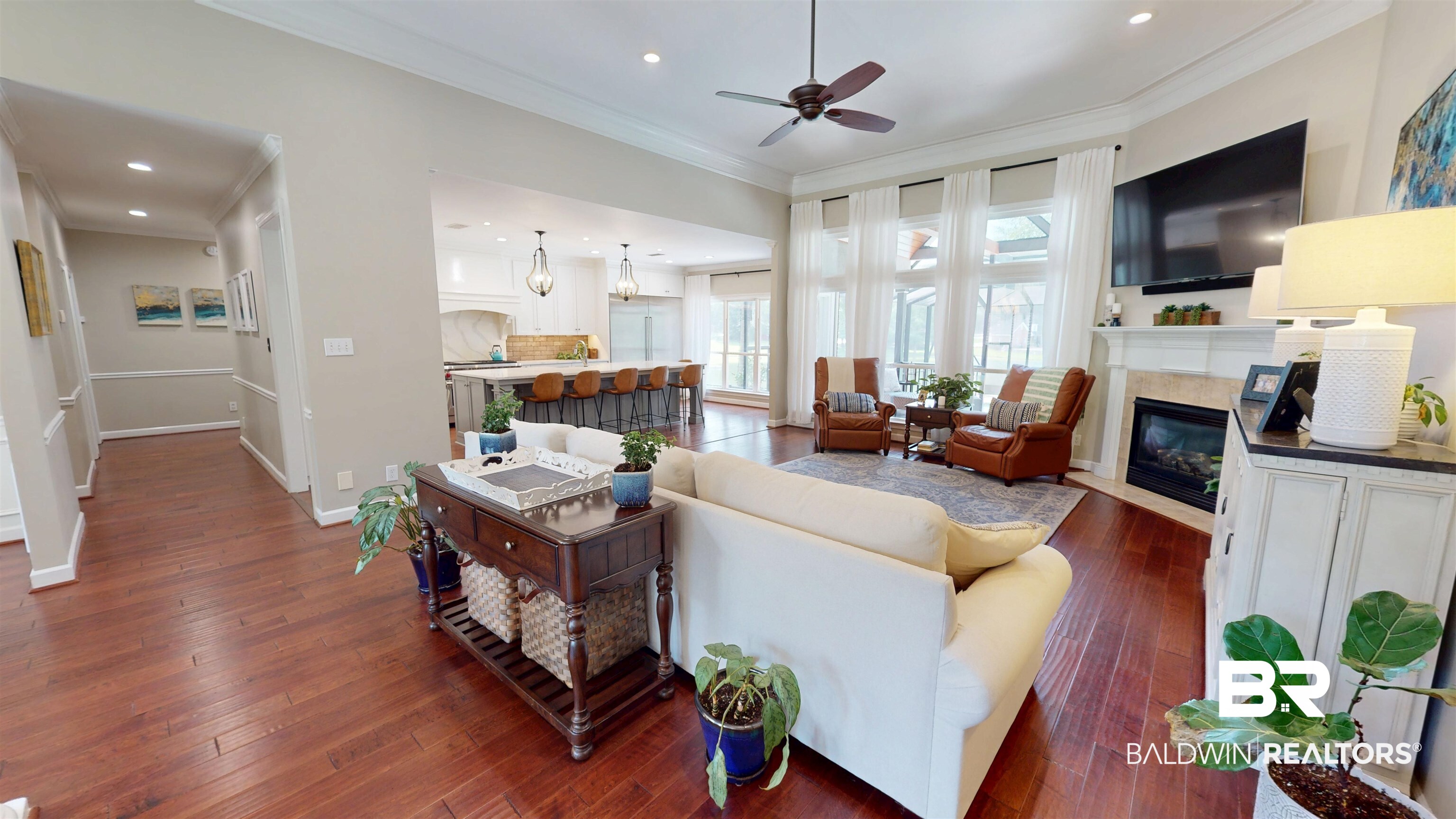 8775 Dawes Lake Road North Mobile, AL 36619 - Photo 23 of 59 Living room with dark wood-style flooring, crown molding, ceiling fan, a premium fireplace, and recessed lighting