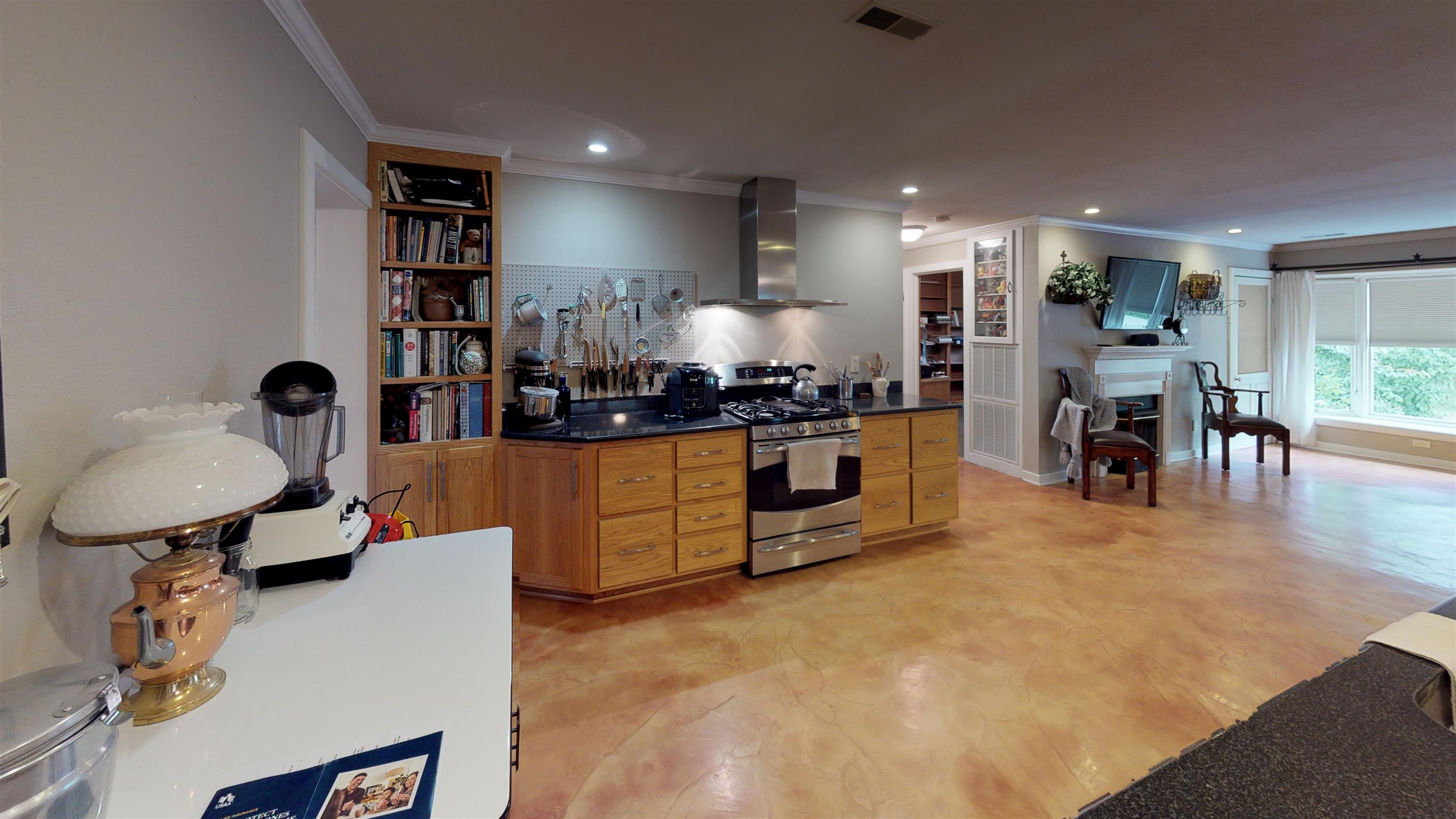 800 Hadley Road Clarksville, TN 37042 - Photo 12 of 17 a kitchen with stainless steel appliances a refrigerator a stove a sink and a dining table
