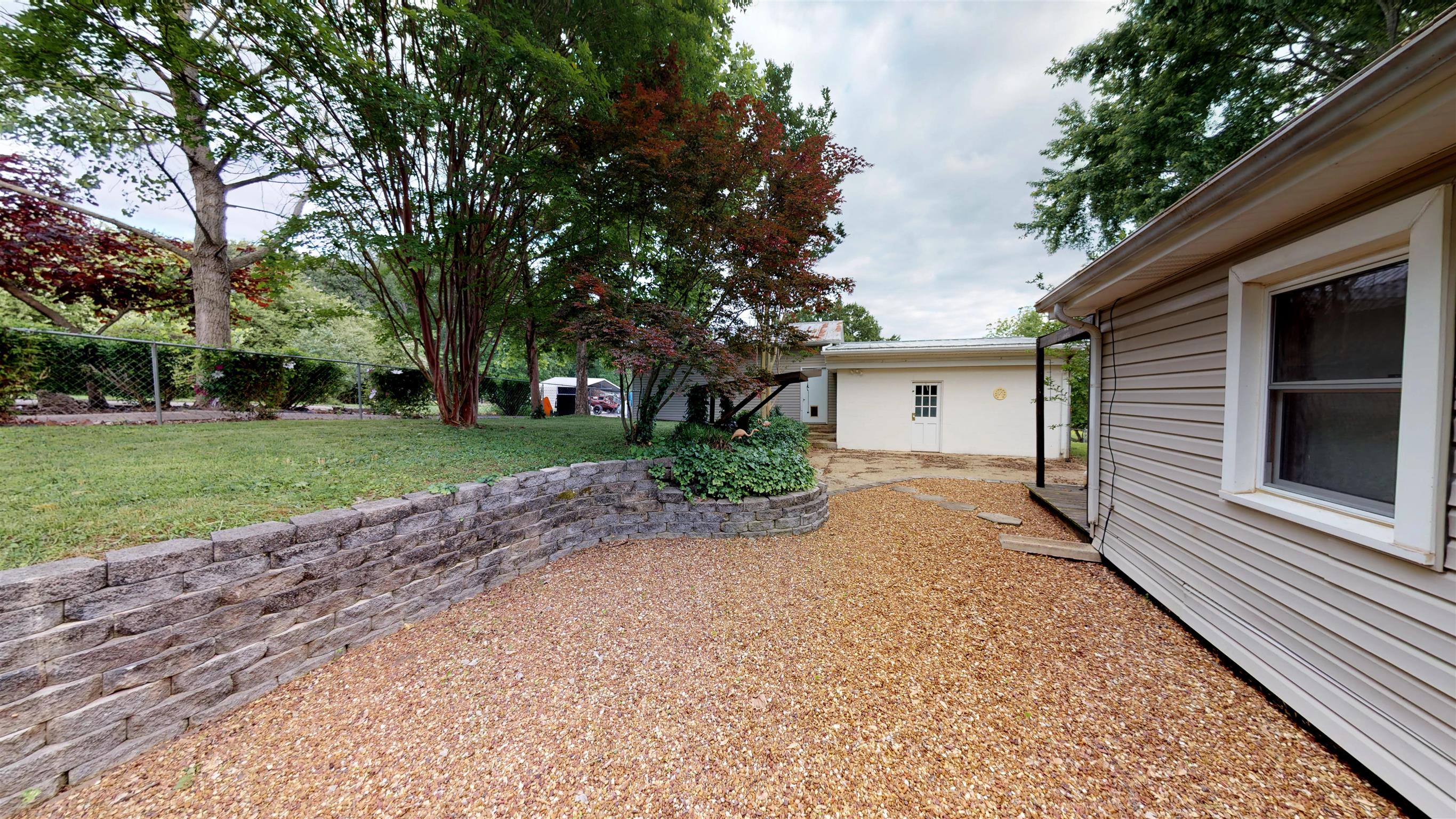 800 Hadley Road Clarksville, TN 37042 - Photo 9 of 17 a view of a house with a yard and garage