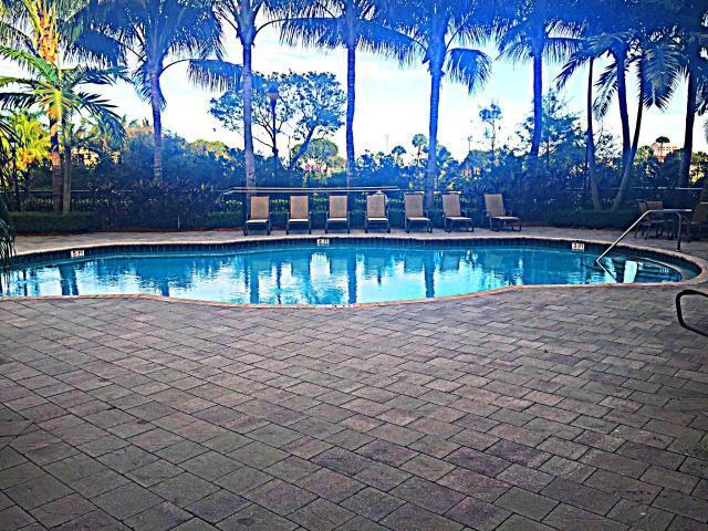 1660 Renaissance Commons Boulevard, Unit 2619 Boynton Beach, FL 33426 - Photo 15 of 20 a view of swimming pool with a yard and tree s
