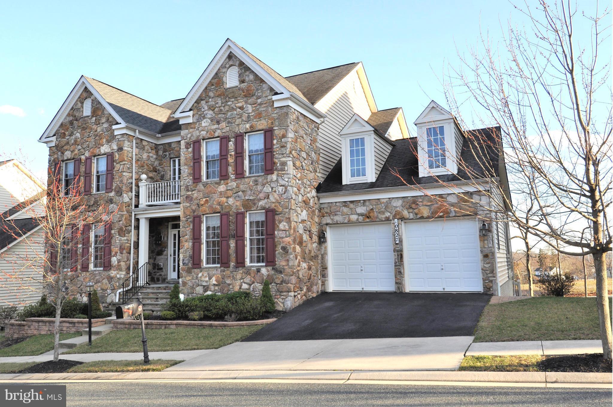 10827 Catron Road Perry Hall, MD 21128 - Photo 1 of 27 a front view of a house with a garden
