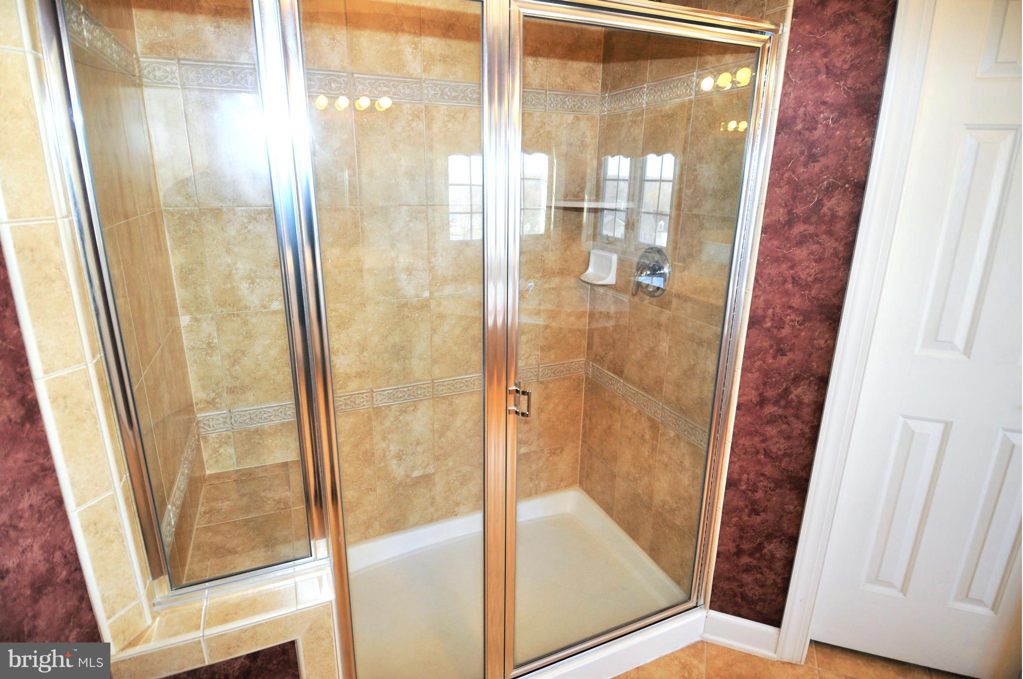 10827 Catron Road Perry Hall, MD 21128 - Photo 11 of 27 a bathroom with a glass door and shower