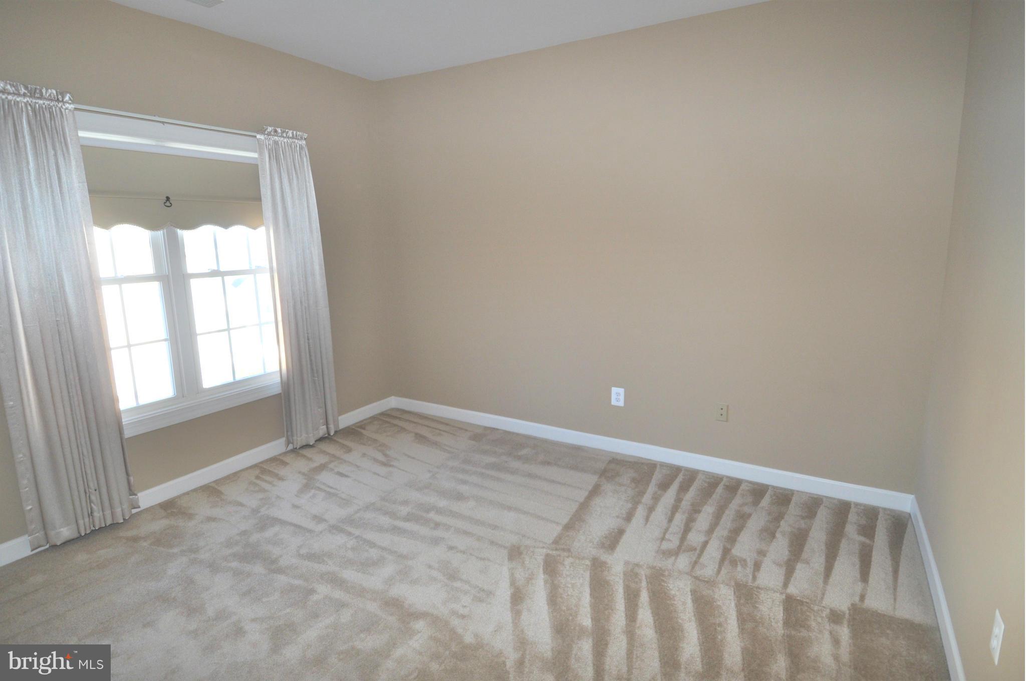 10827 Catron Road Perry Hall, MD 21128 - Photo 14 of 27 a view of an empty room with a window