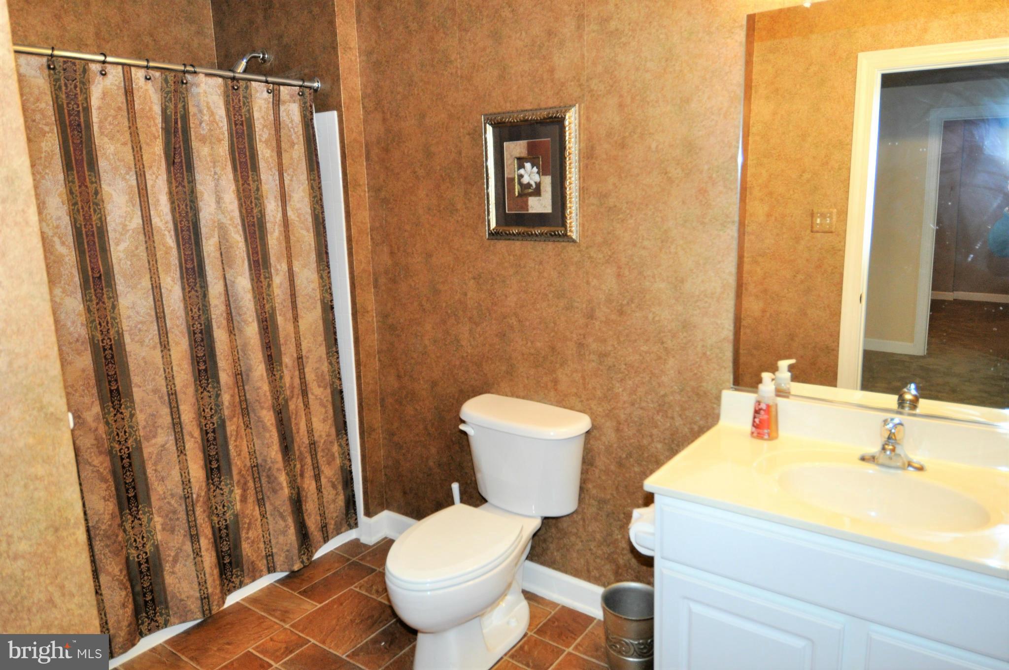 10827 Catron Road Perry Hall, MD 21128 - Photo 19 of 27 a bathroom with a sink and a toilet