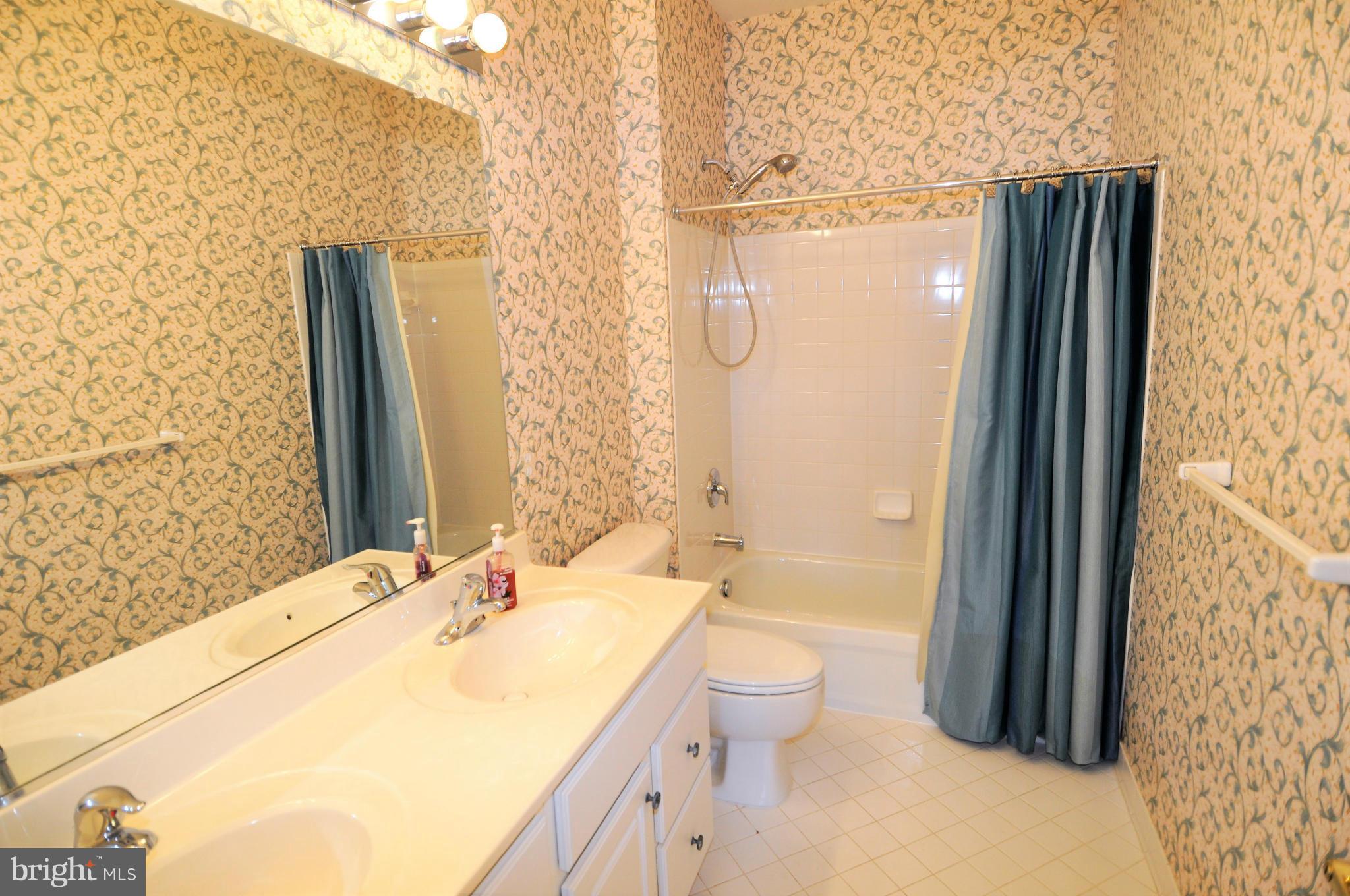 10827 Catron Road Perry Hall, MD 21128 - Photo 22 of 27 a bathroom with a granite countertop sink toilet and shower