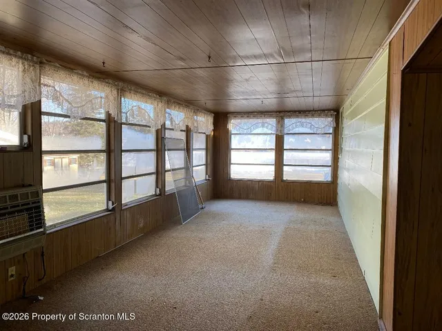 a view of walk in closet and window