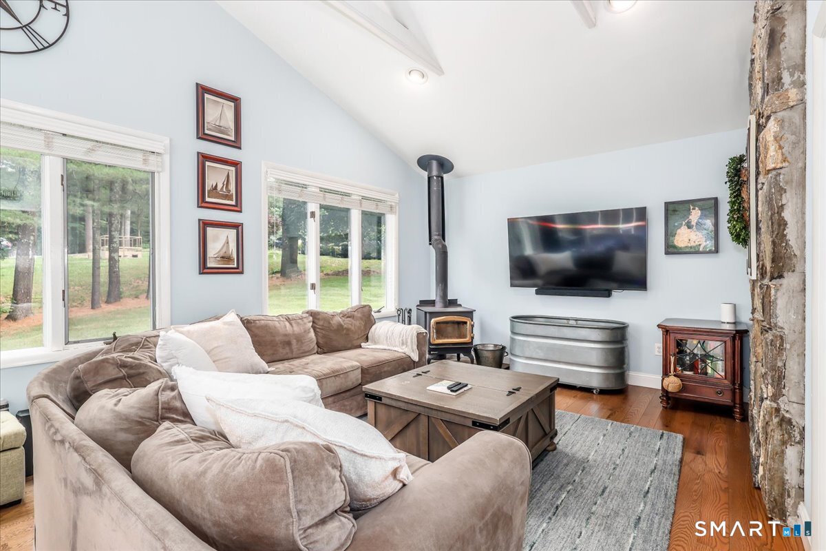 31 Aspen Mill Road Ridgefield, CT 06877 - Photo 11 of 38 Wood stove adds heat and warmth to the entire first floor