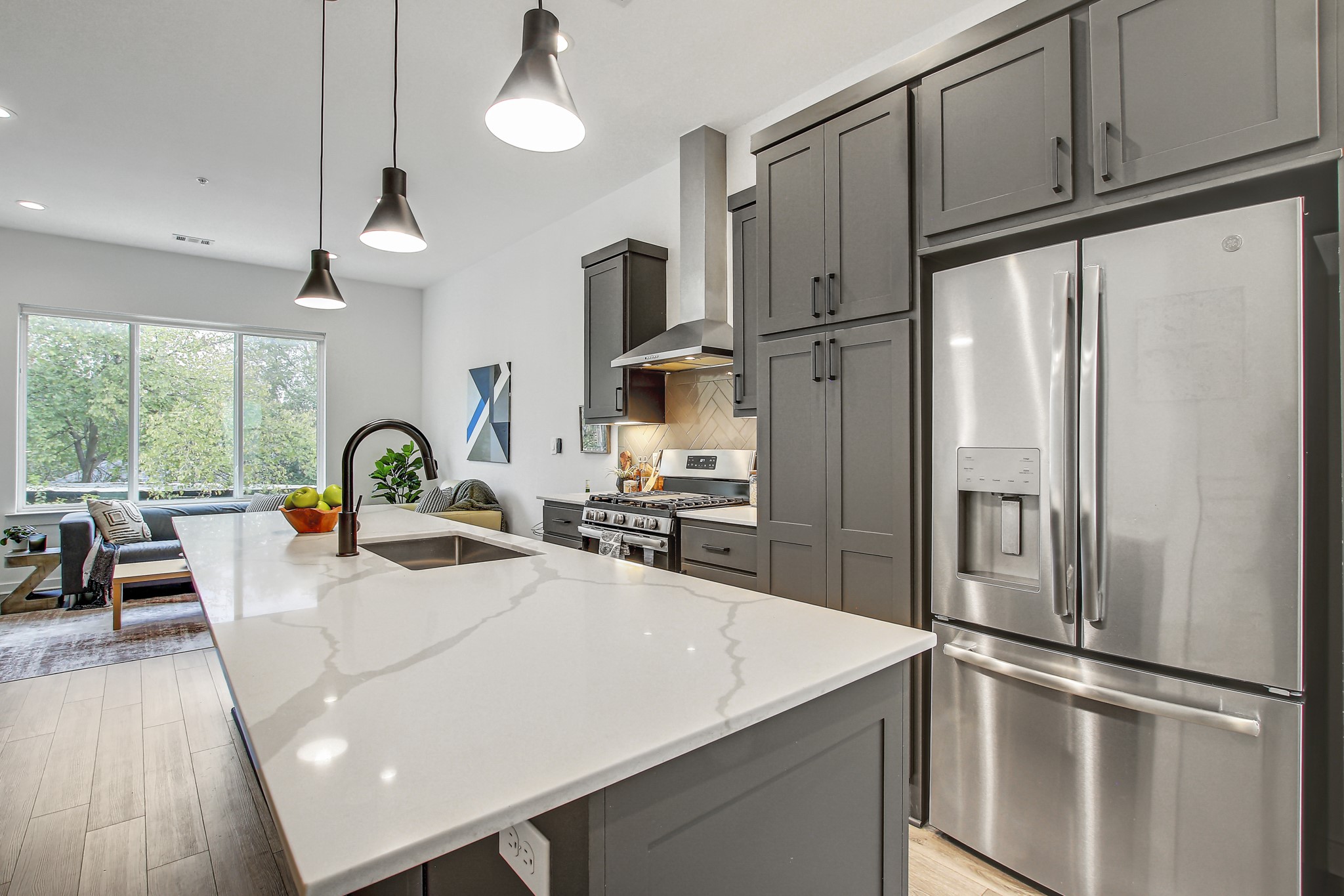 2804 South 1st Street, Unit 1108 Austin, TX 78704 - Photo 11 of 40 a kitchen with stainless steel appliances a refrigerator sink and cabinets