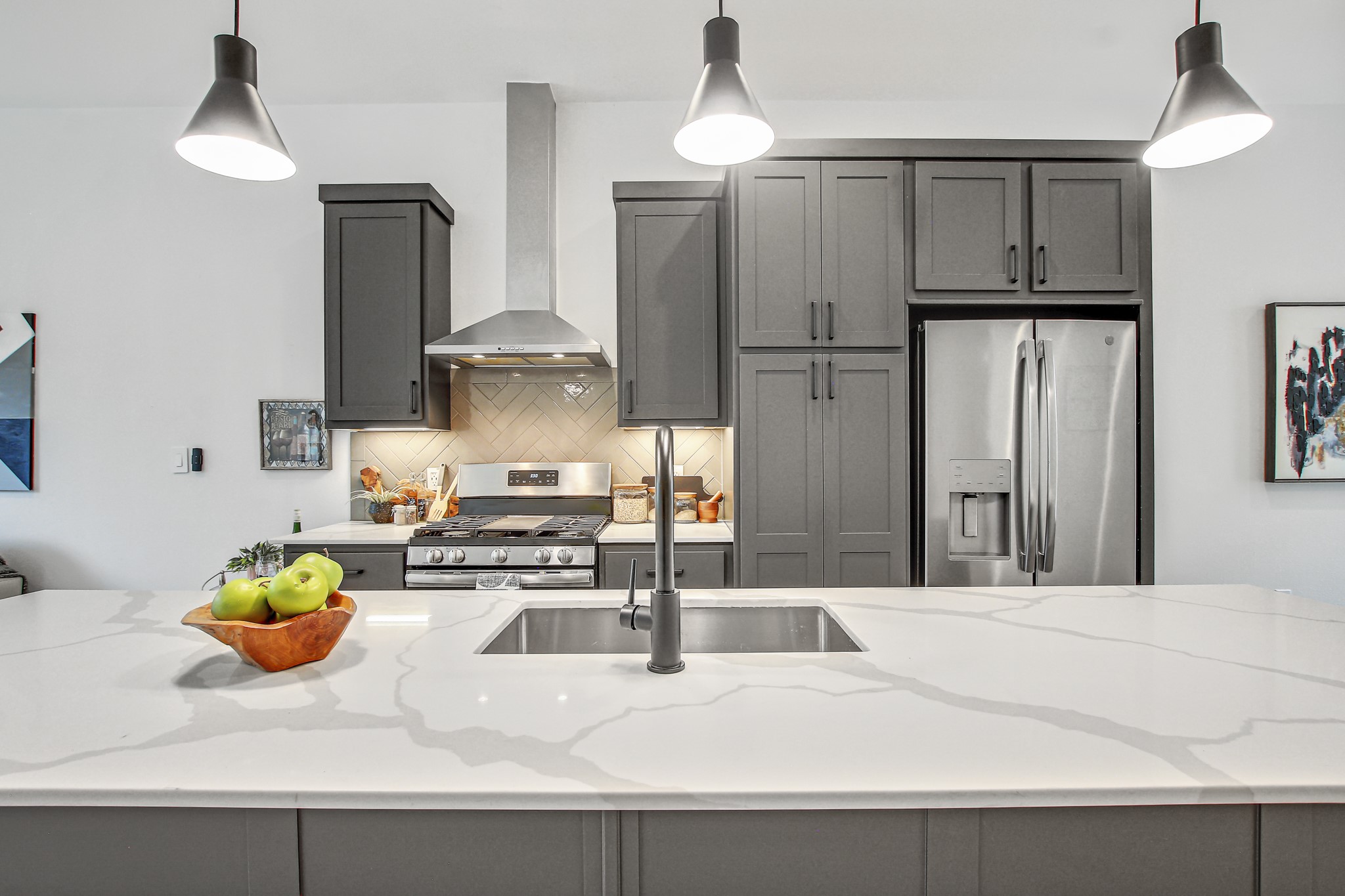 2804 South 1st Street, Unit 1108 Austin, TX 78704 - Photo 14 of 40 a kitchen with stainless steel appliances granite countertop a sink refrigerator and stove