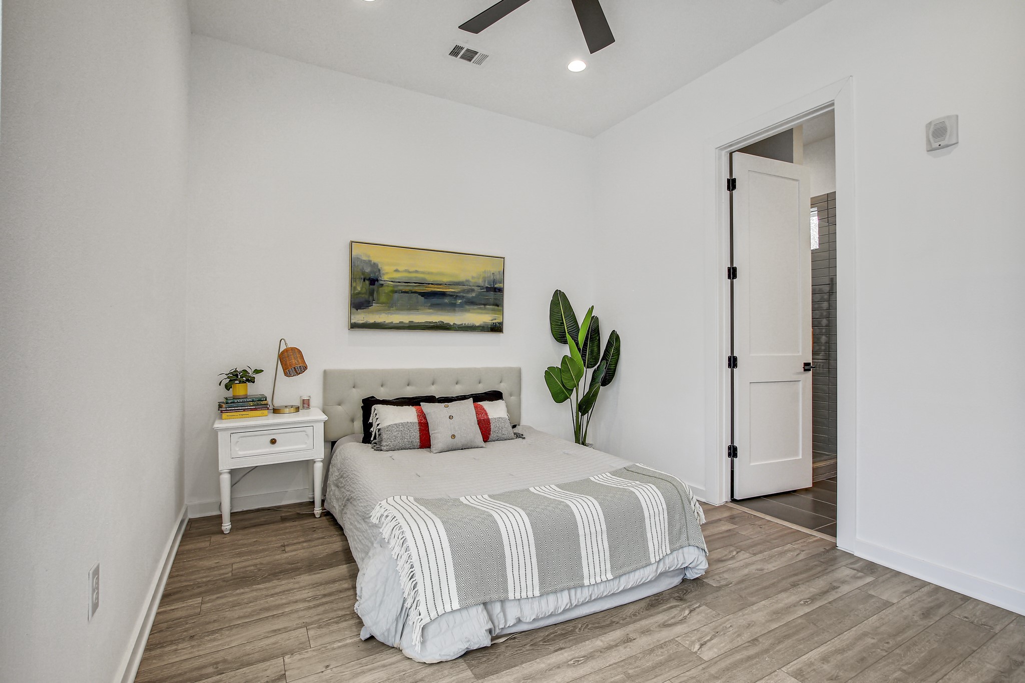 2804 South 1st Street, Unit 1108 Austin, TX 78704 - Photo 16 of 40 a bedroom with a bed and a table