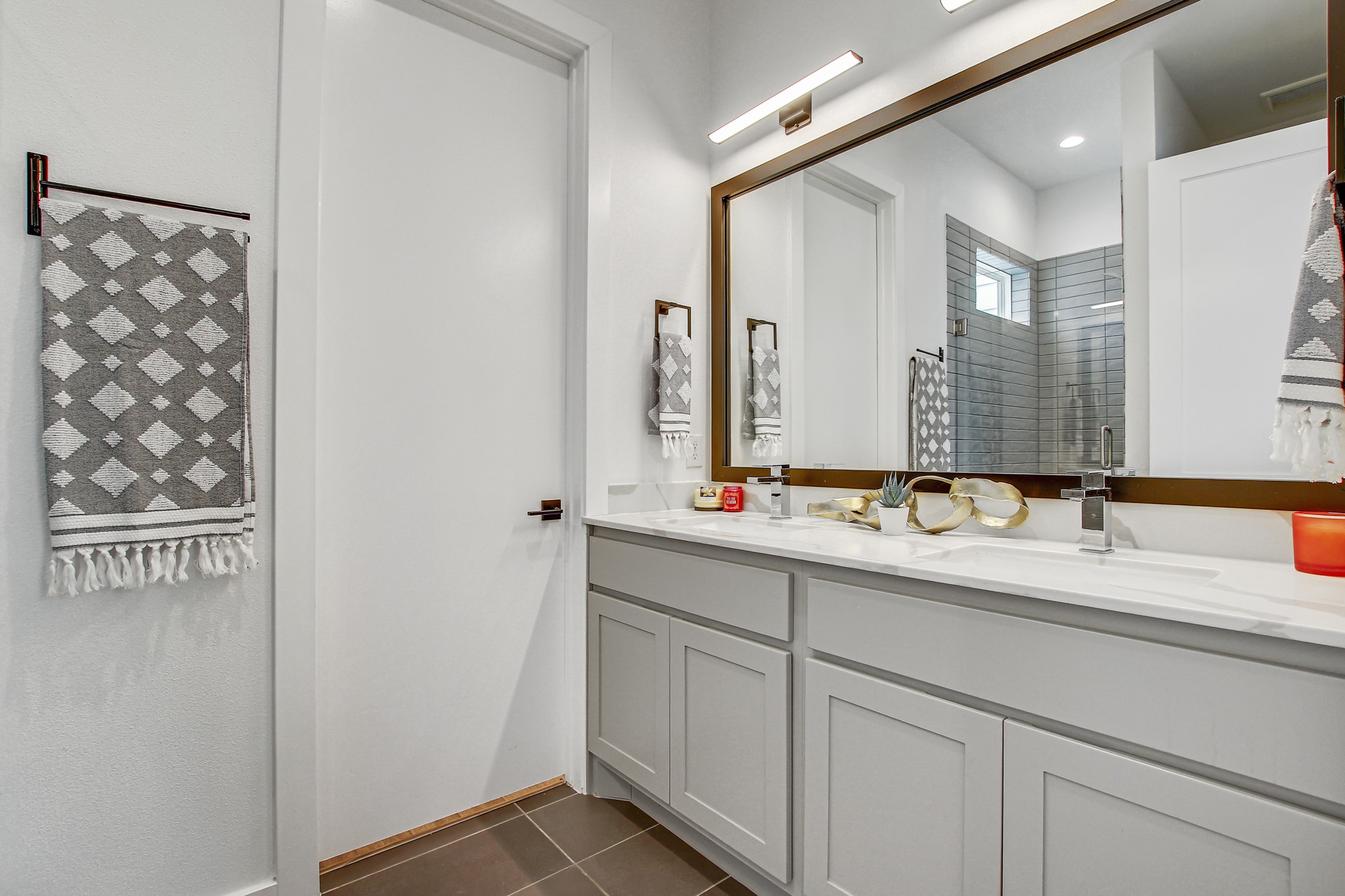 2804 South 1st Street, Unit 1108 Austin, TX 78704 - Photo 23 of 40 a bathroom with a double vanity sink and a mirror