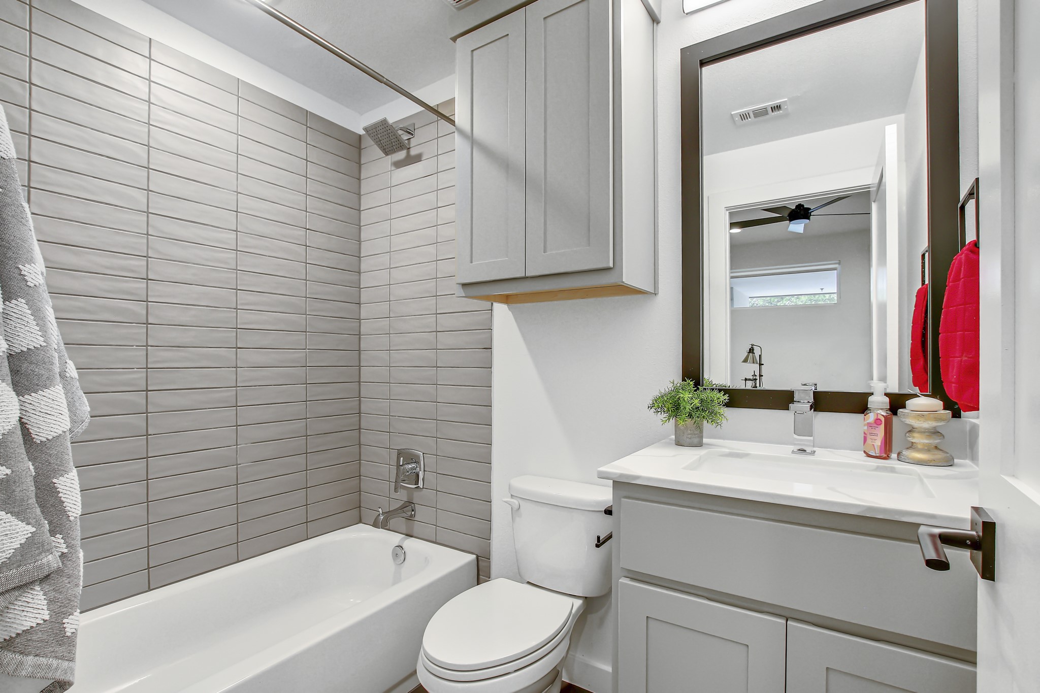 2804 South 1st Street, Unit 1108 Austin, TX 78704 - Photo 26 of 40 a bathroom with a sink a toilet and shower