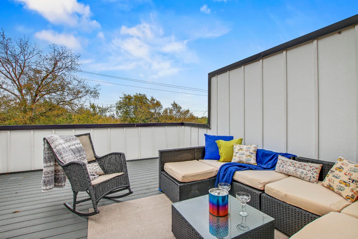 2804 South 1st Street, Unit 1108 Austin, TX 78704 - Photo 30 of 40 a balcony with outdoor seating and wooden floor