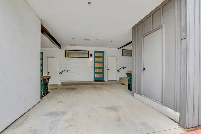 a couple of cars parked in front of building