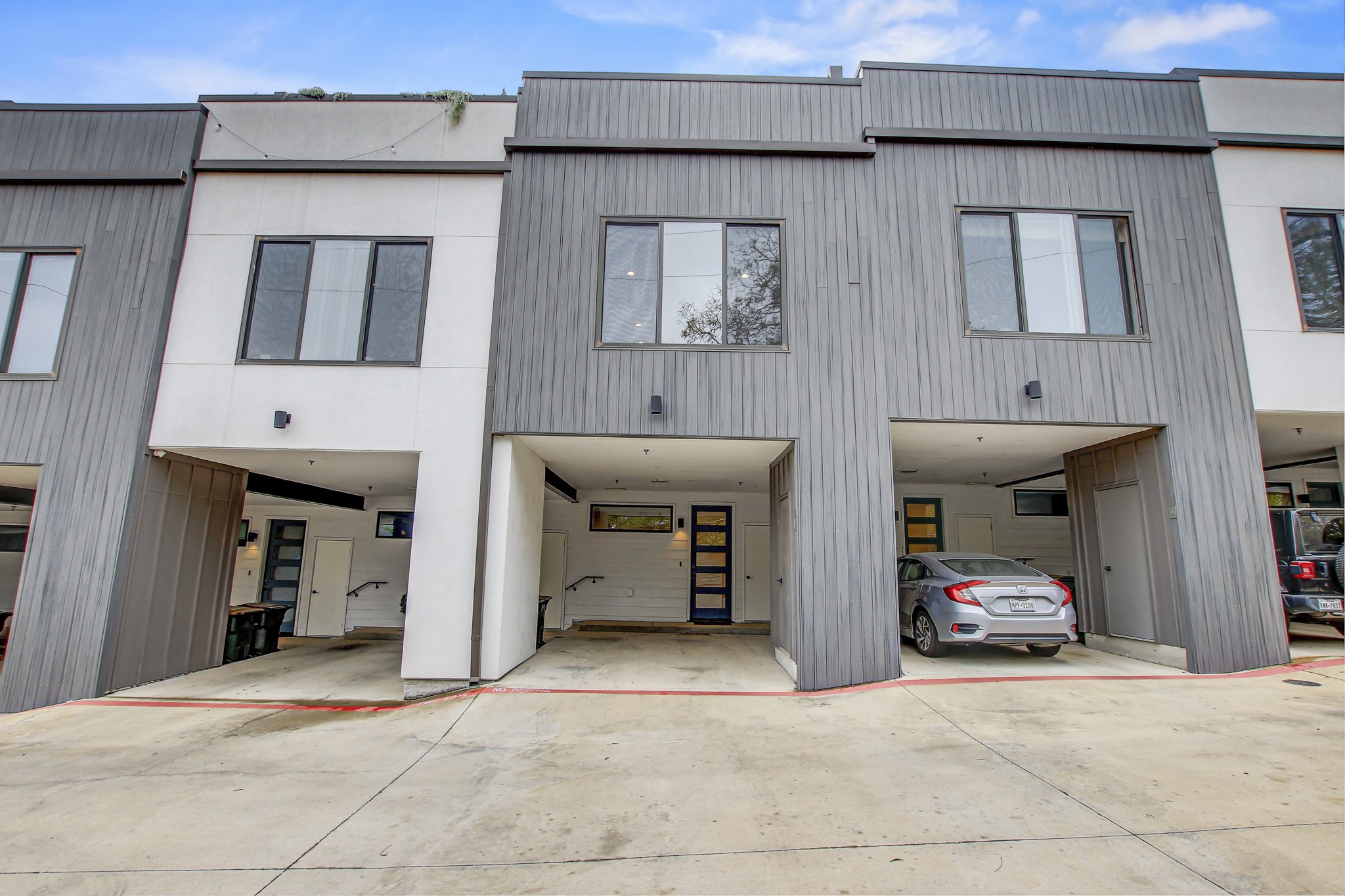 2804 South 1st Street, Unit 1108 Austin, TX 78704 - Photo 33 of 40 a couple of cars parked in front of building