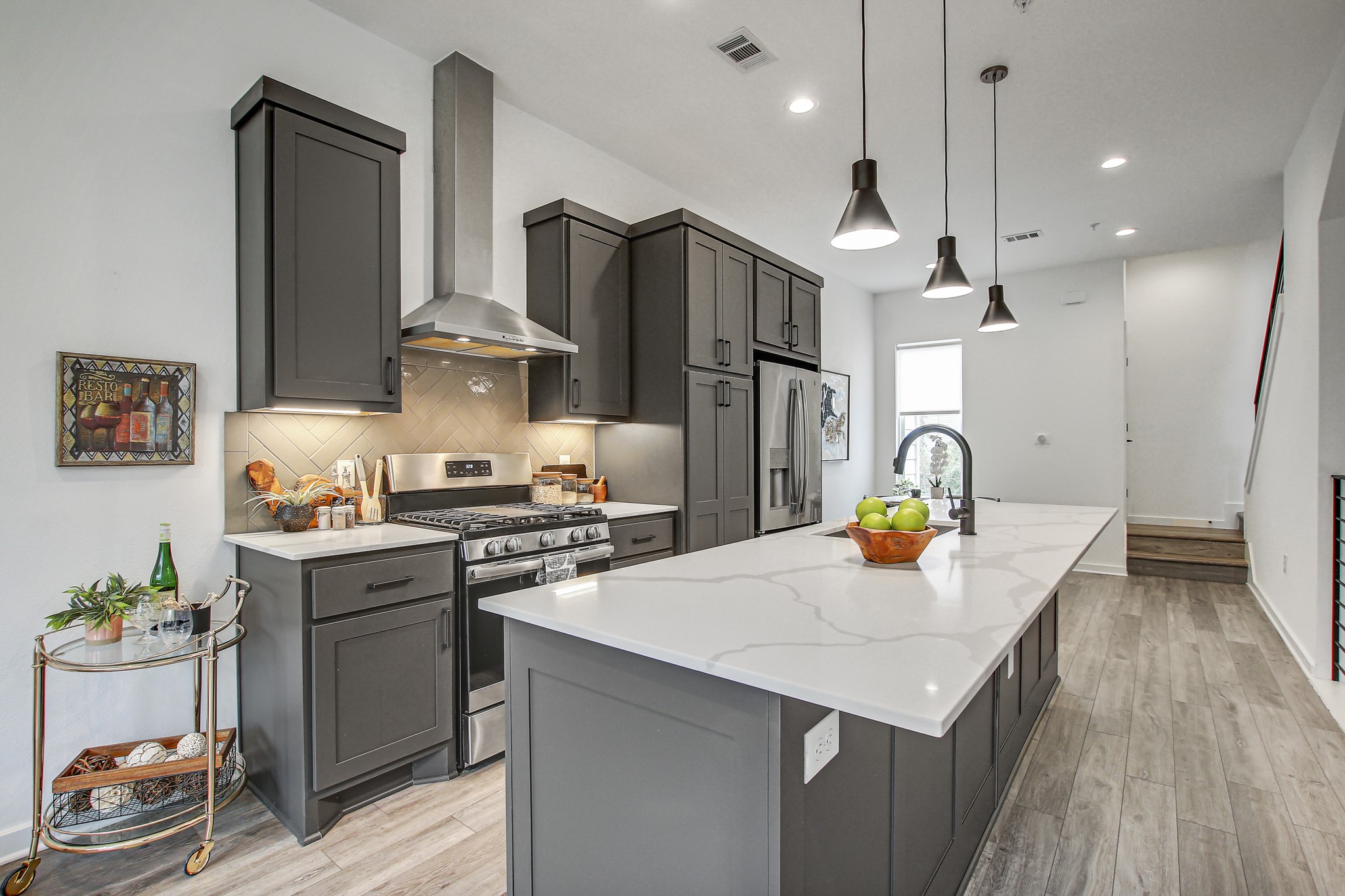 2804 South 1st Street, Unit 1108 Austin, TX 78704 - Photo 8 of 40 a kitchen with stainless steel appliances a sink a stove and refrigerator