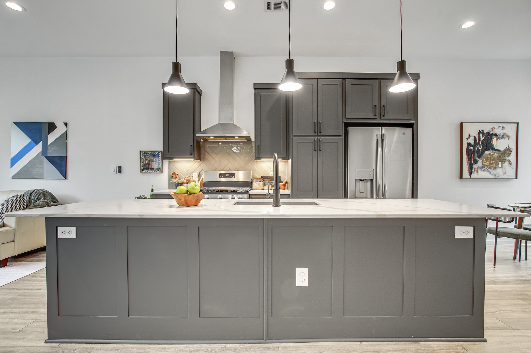 2804 South 1st Street, Unit 1108 Austin, TX 78704 - Photo 9 of 40 a kitchen with stainless steel appliances a sink a refrigerator a center island a stove and a sink