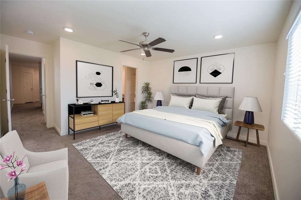 12603 Telge Road, Unit 7D Cypress, TX 77429 - Photo 3 of 19 a bedroom with a bed and a chandelier