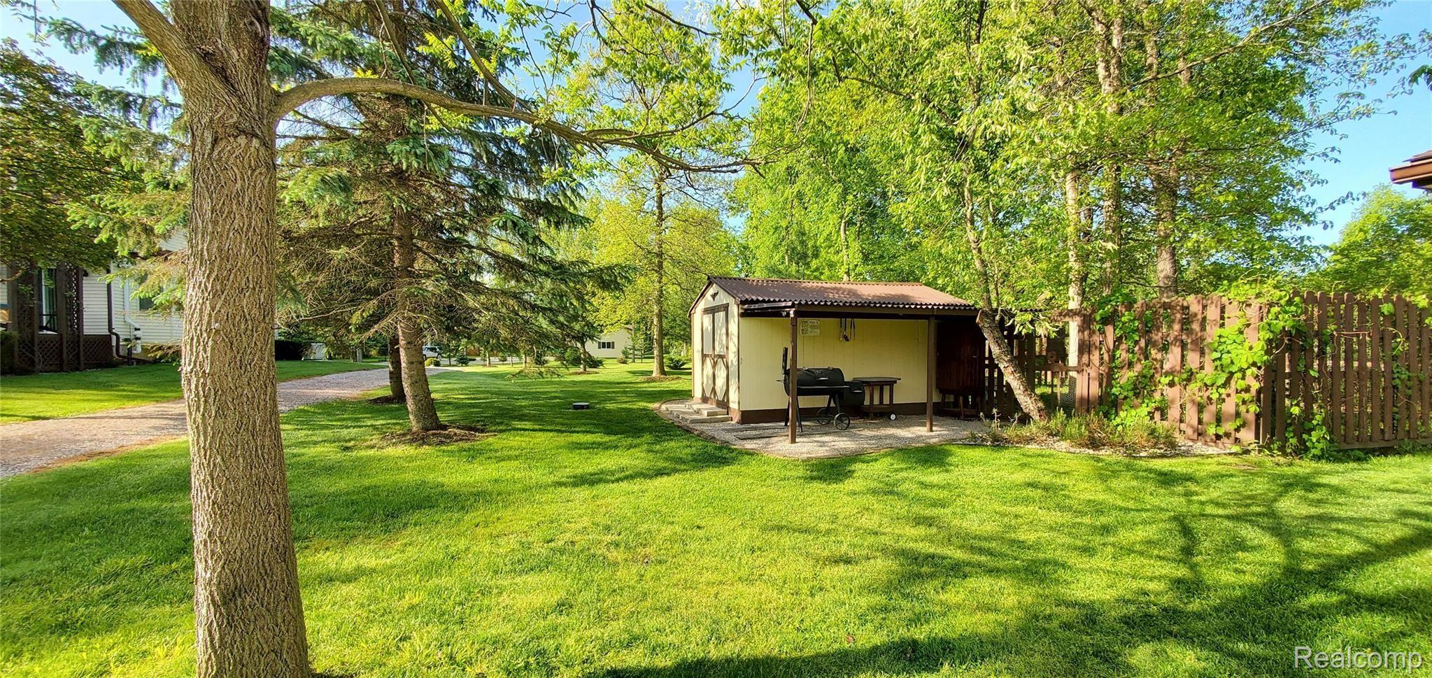 5520 Lowe Road Fowlerville, MI 48836 - Photo 66 of 86 5520 West Lowe Shed View with smoker grill