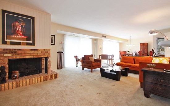 1621 Mission Hills Road, Unit 503 Northbrook, IL 60062 - Photo 3 of 10 a living room with furniture large window and fireplace