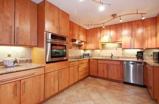 1621 Mission Hills Road, Unit 503 Northbrook, IL 60062 - Photo 4 of 10 a kitchen with stainless steel appliances granite countertop a sink and cabinets