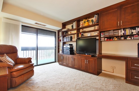 1621 Mission Hills Road, Unit 503 Northbrook, IL 60062 - Photo 7 of 10 a living room with furniture and a flat screen tv