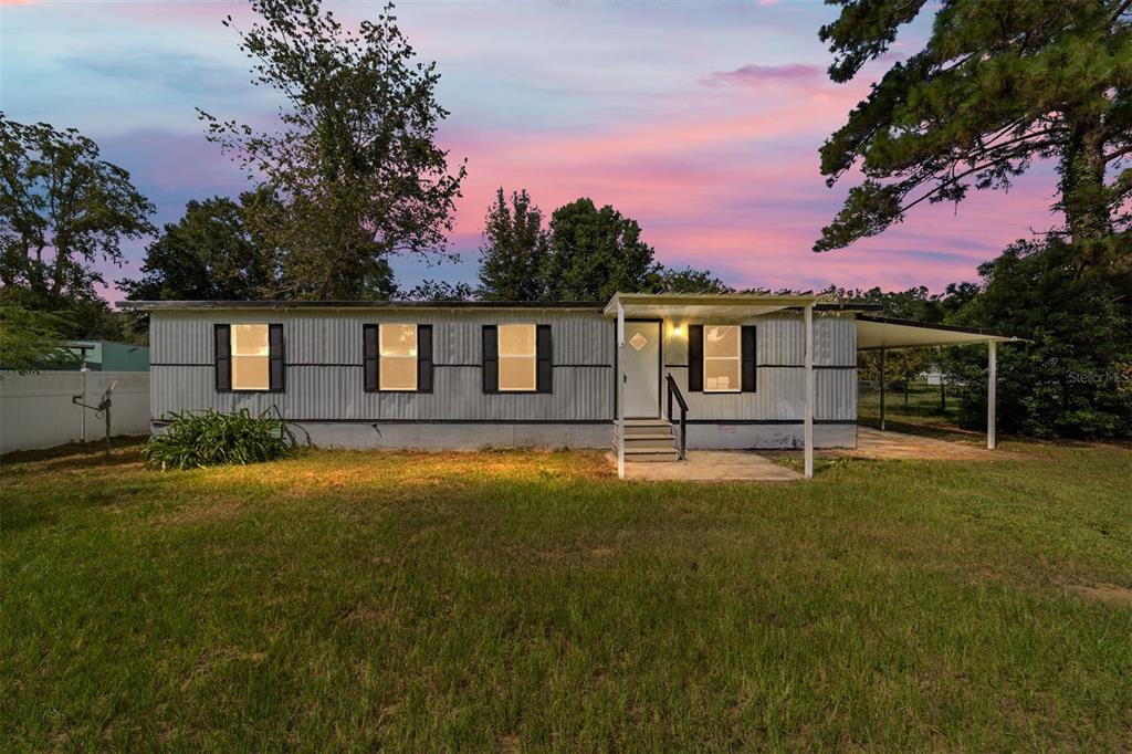 a house view with a garden space