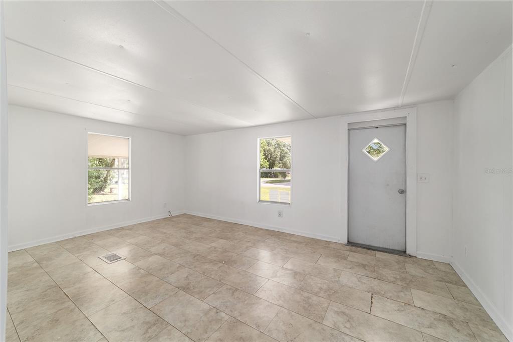 3081 Southwest 90th Street Ocala, FL 34476 - Photo 12 of 34 an empty room with windows and closet