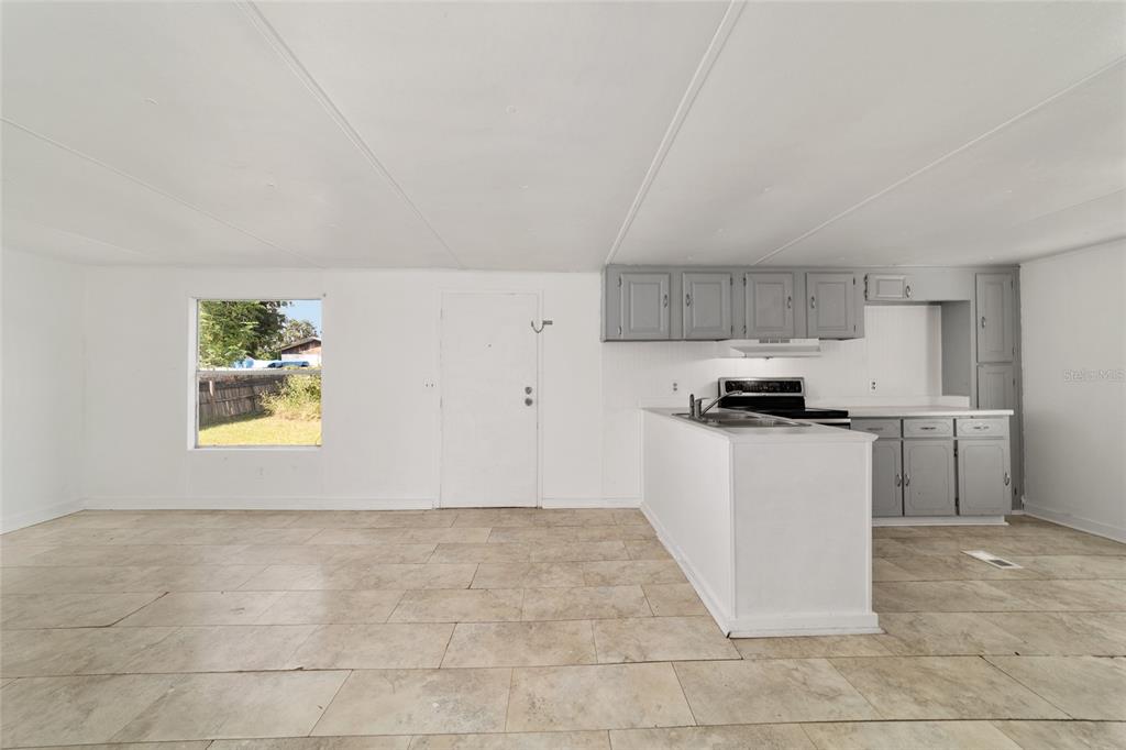 3081 Southwest 90th Street Ocala, FL 34476 - Photo 13 of 34 a kitchen with a sink cabinets and appliances