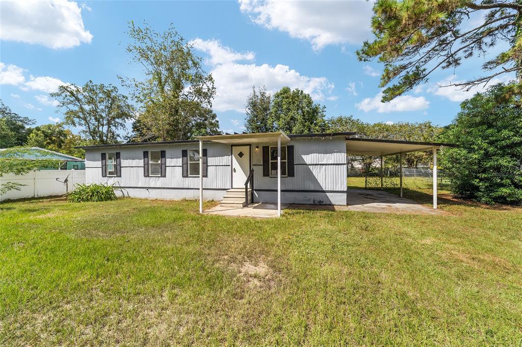 3081 Southwest 90th Street Ocala, FL 34476 - Photo 2 of 34 a view of a house with pool and chairs
