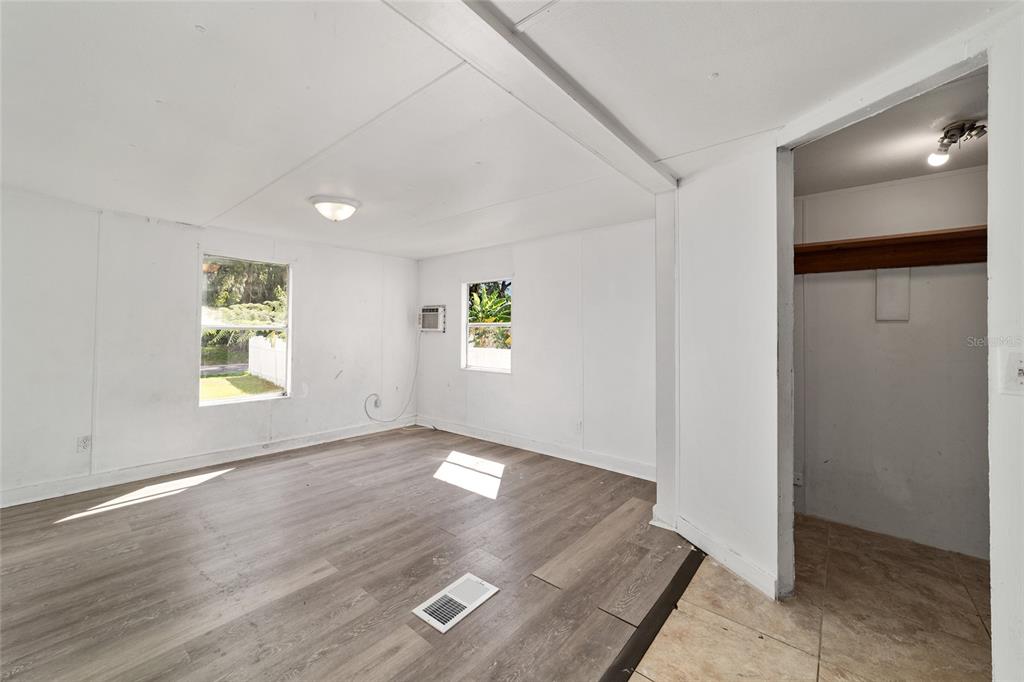 3081 Southwest 90th Street Ocala, FL 34476 - Photo 22 of 34 an empty room with windows and entrance