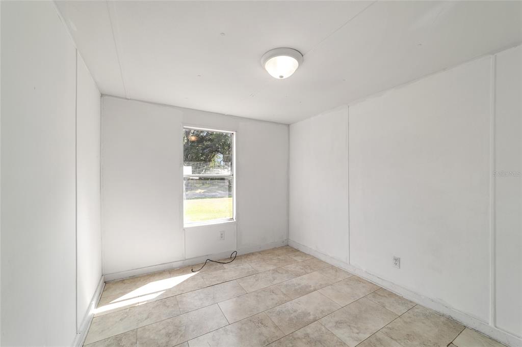 3081 Southwest 90th Street Ocala, FL 34476 - Photo 28 of 34 a view of an empty room with window