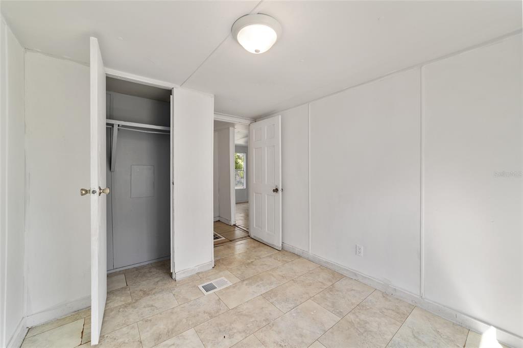 3081 Southwest 90th Street Ocala, FL 34476 - Photo 29 of 34 a view of an empty room with closet and wooden floor