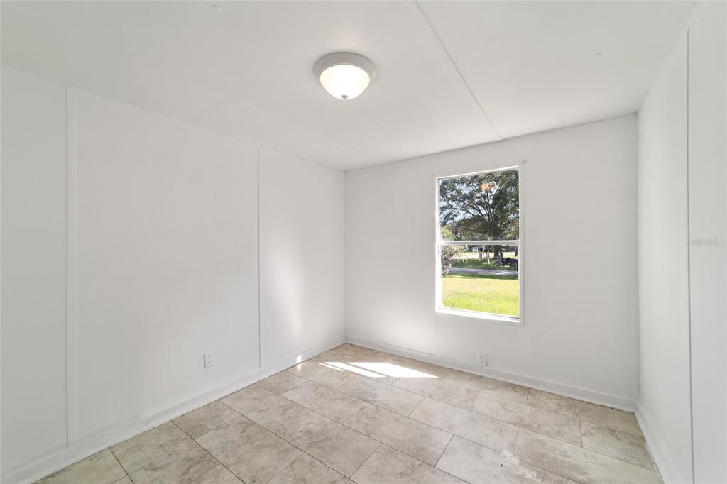 3081 Southwest 90th Street Ocala, FL 34476 - Photo 31 of 34 a view of an empty room with a window