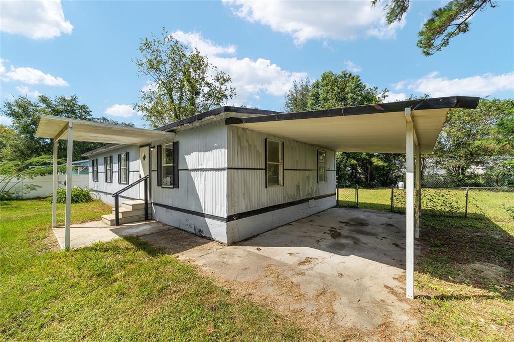 3081 Southwest 90th Street Ocala, FL 34476 - Photo 5 of 34 a view of a house with a backyard