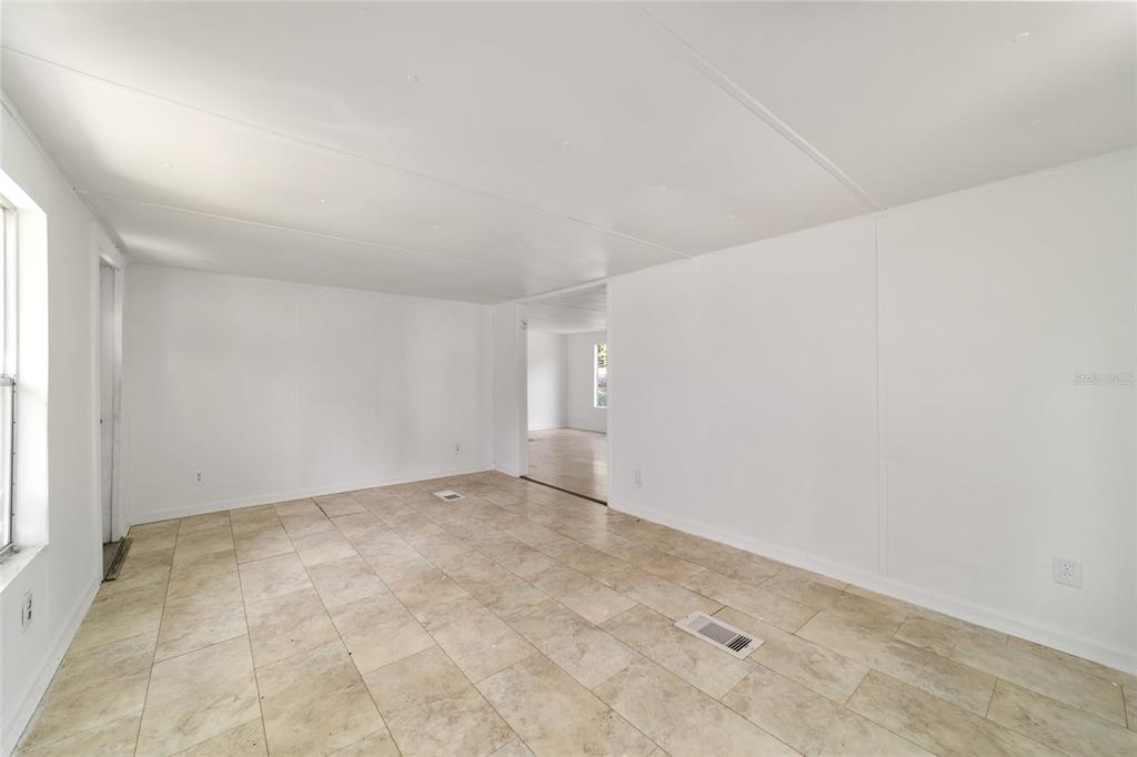 3081 Southwest 90th Street Ocala, FL 34476 - Photo 9 of 34 an empty room with a natural light