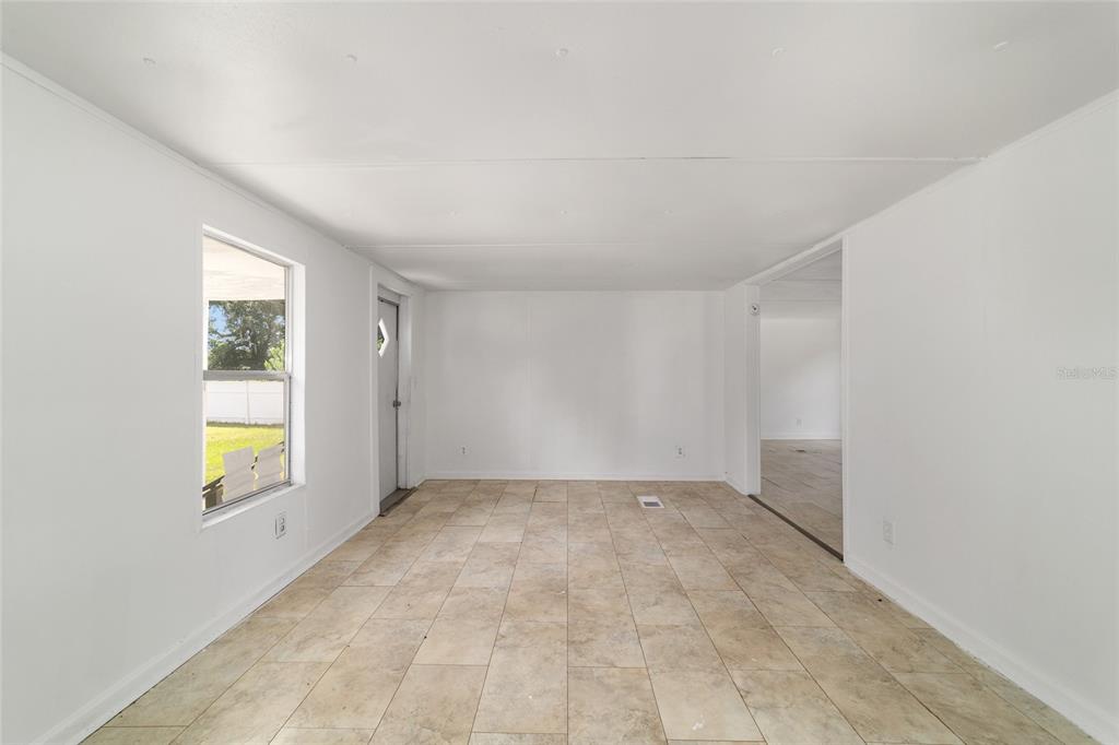 3081 Southwest 90th Street Ocala, FL 34476 - Photo 10 of 34 an empty room with windows